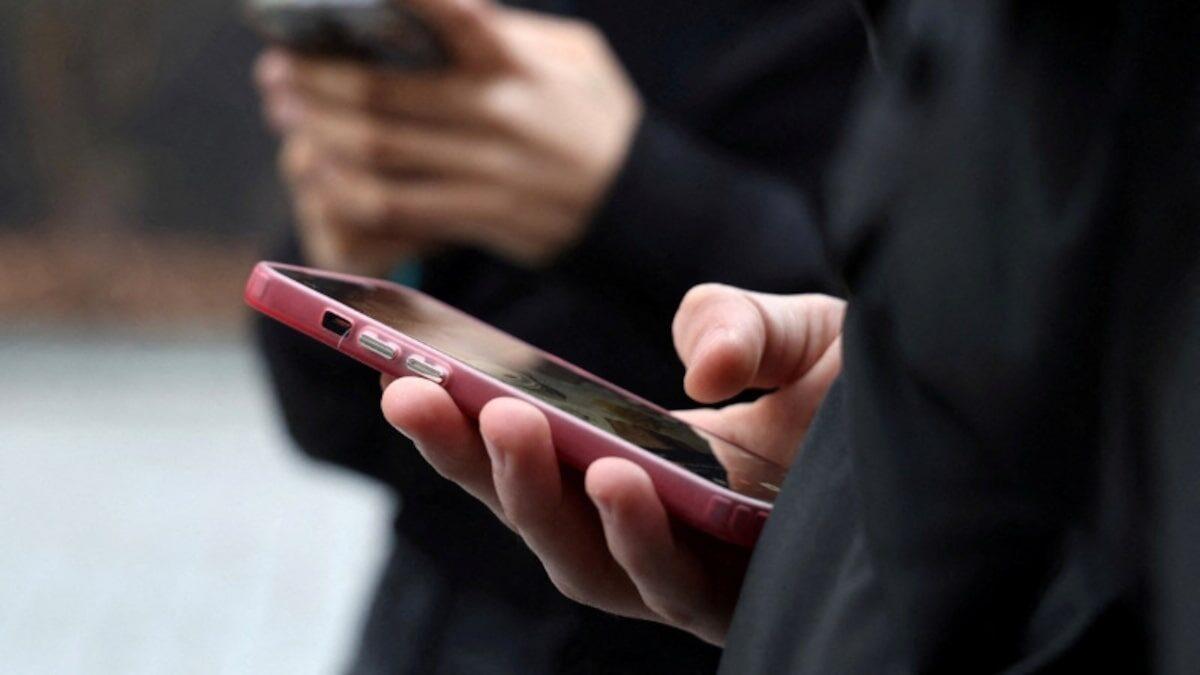 Teenagers using smartphones as the EU considers new child online-safety rules
