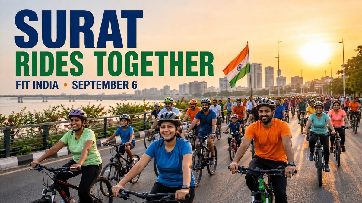 A large community cycling group riding through a street in Surat