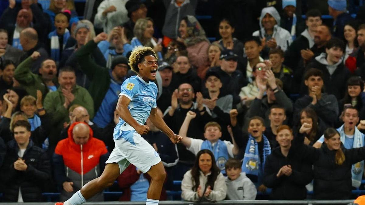 Floyd Samba celebrates during his Manchester City debut against Norwich City