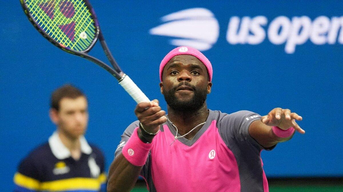 Frances Tiafoe hits a forehand during his 2026 US Open quarterfinal against Alex Michelsen at Arthur Ashe Stadium