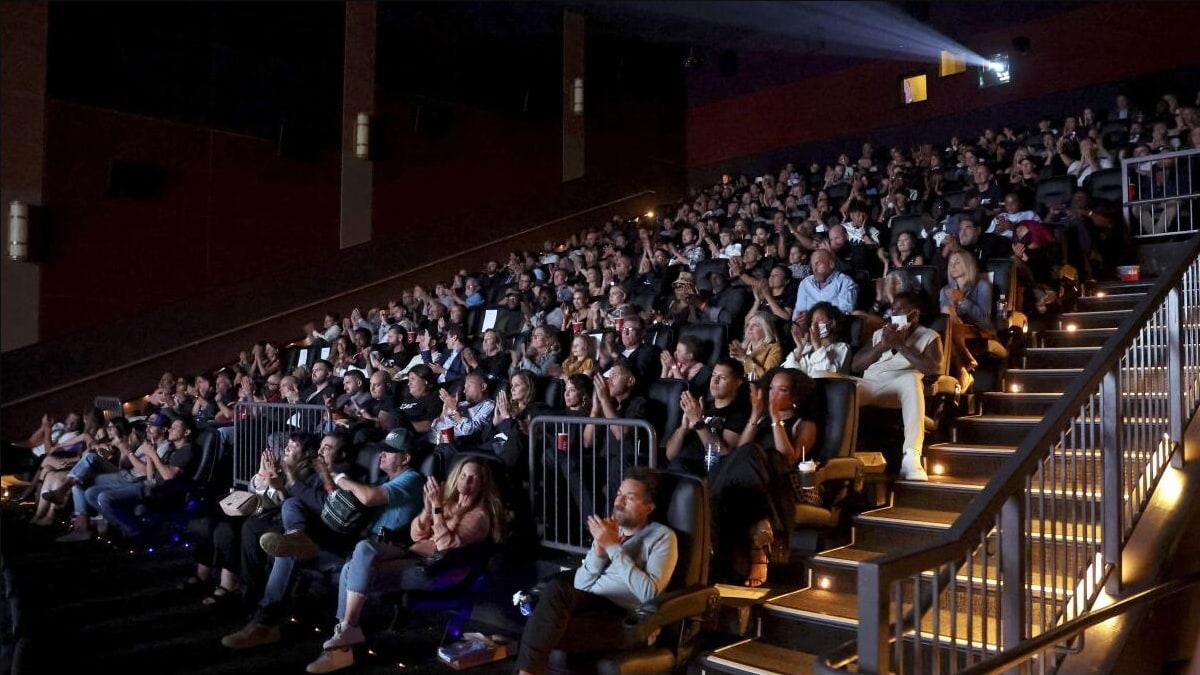 Moviegoers inside a theatre for Hollywood box-office coverage