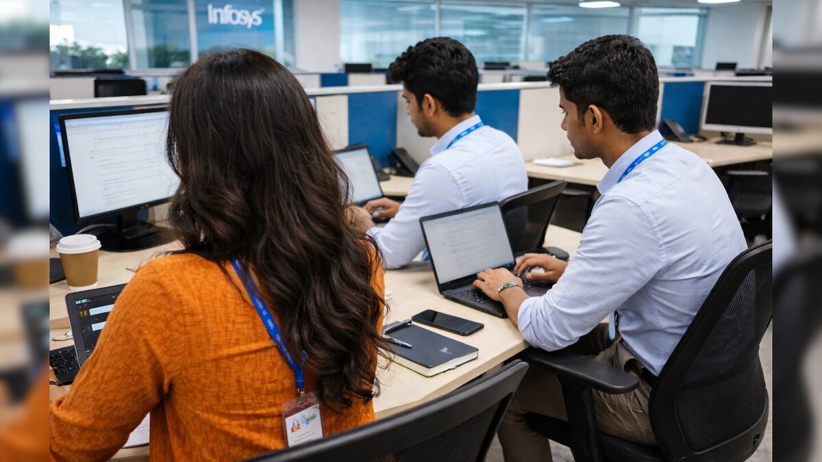 Employees working inside a modern Indian information technology services office