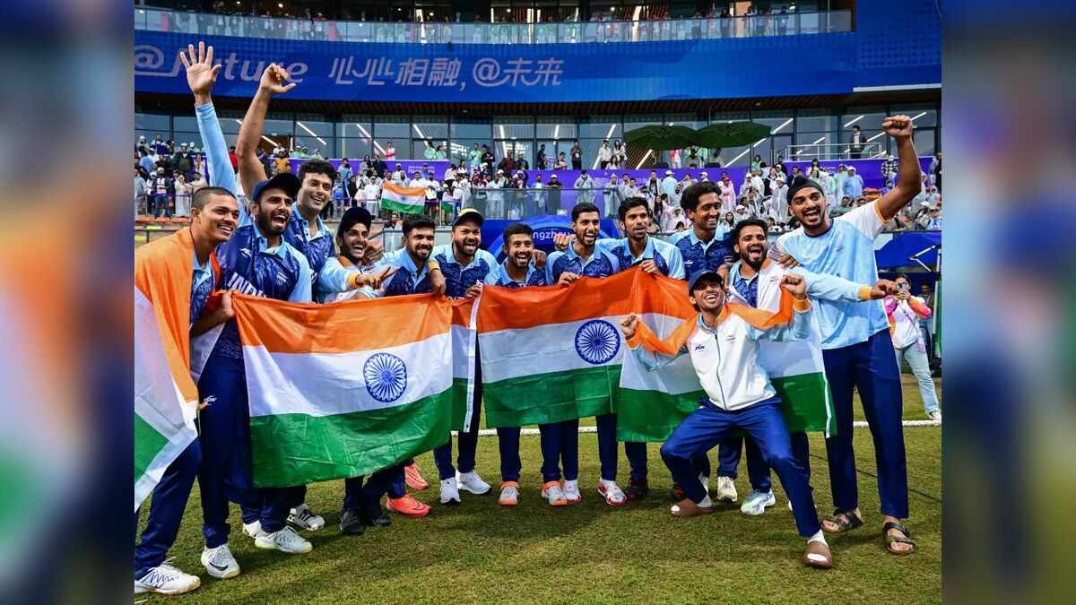 India players celebrating their 2026 Asian Games men's cricket gold after beating Pakistan in the final