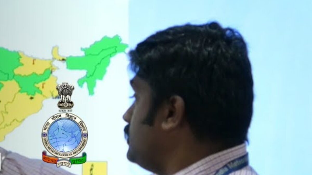 An India Meteorological Department forecaster points to a weather-warning map