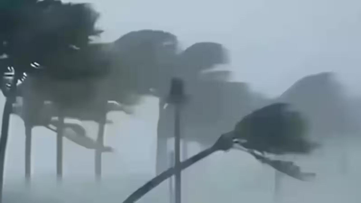 Dark monsoon clouds and heavy rain over an Indian city road