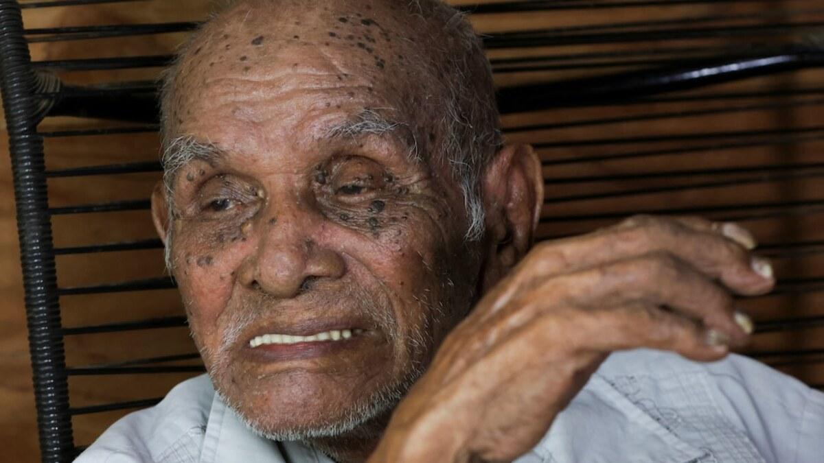 Jose Flores sits at his home in Sardinal, Costa Rica
