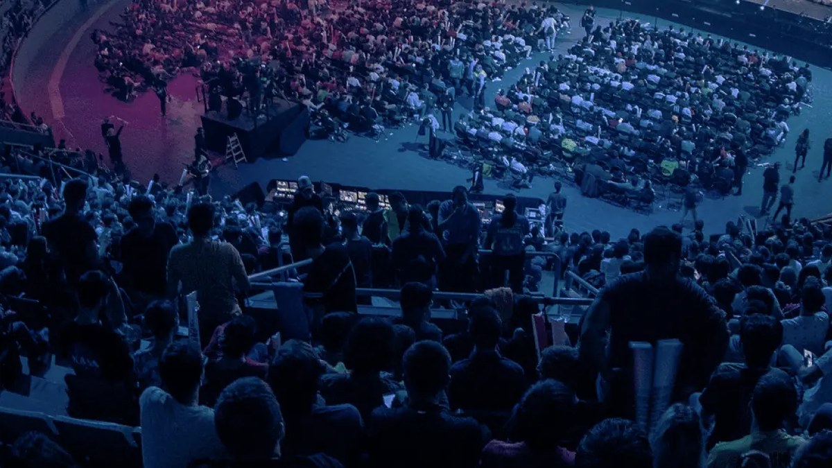 League of Legends competitors seated on stage during an international esports event