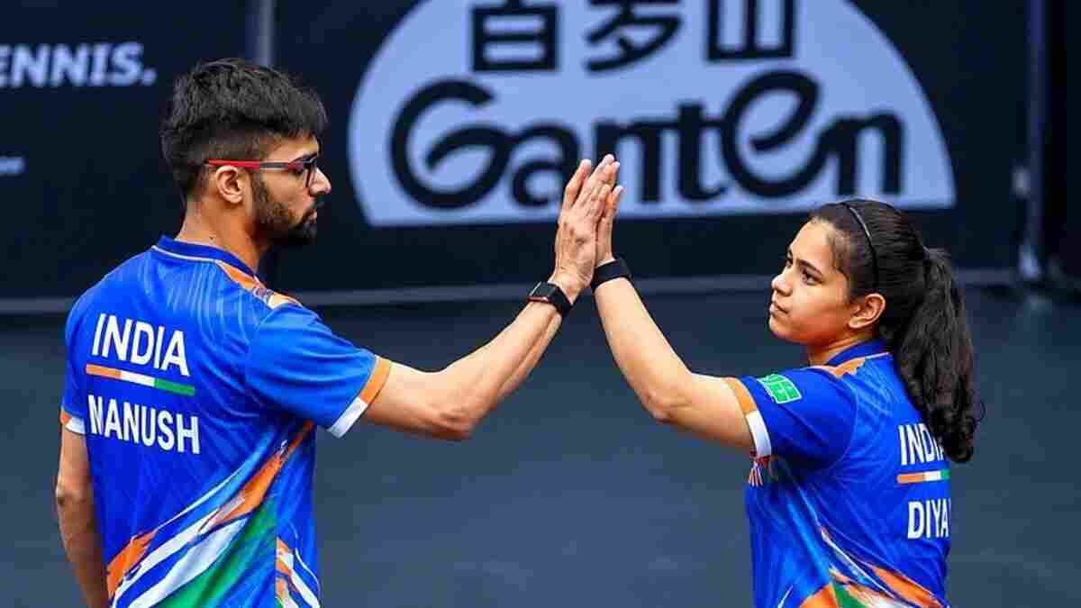 Manush Shah and Diya Chitale celebrate at a table tennis event