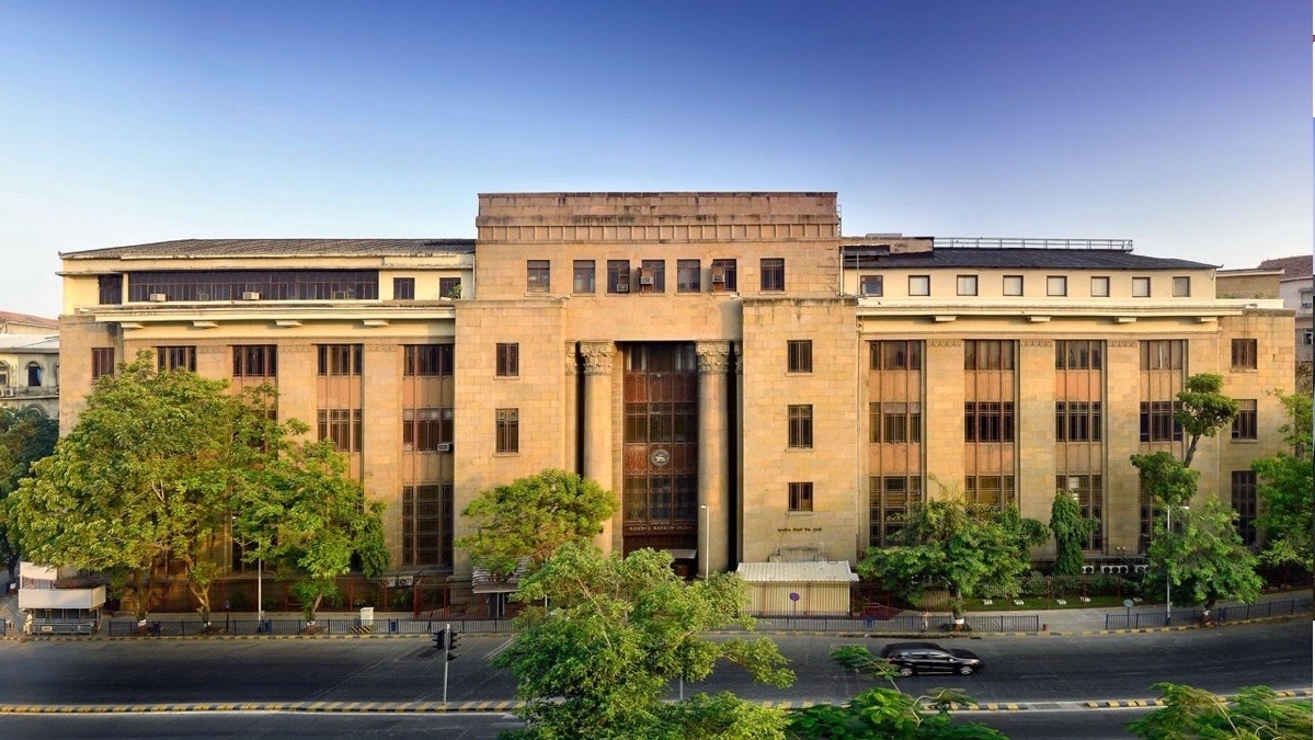 Reserve Bank of India building with interest-rate graphic