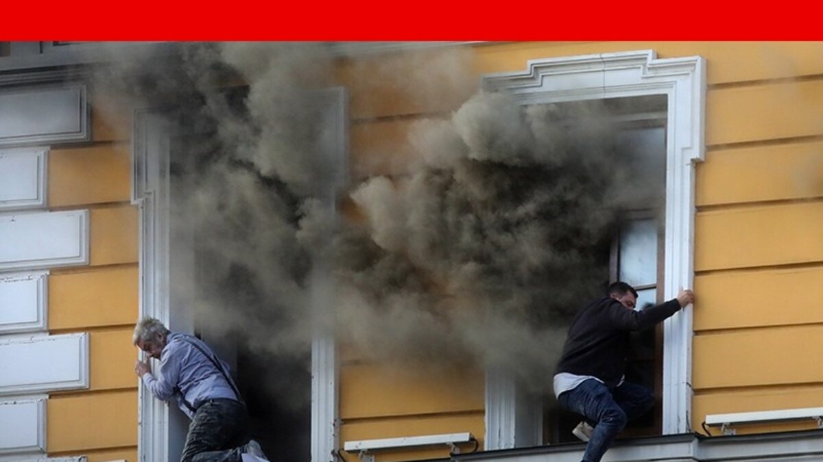 Smoke pours from a Kyiv building after a reported Russian drone strike