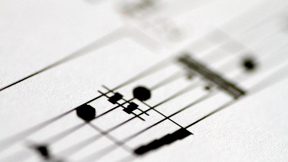 Close-up of printed musical notes representing AI music creation