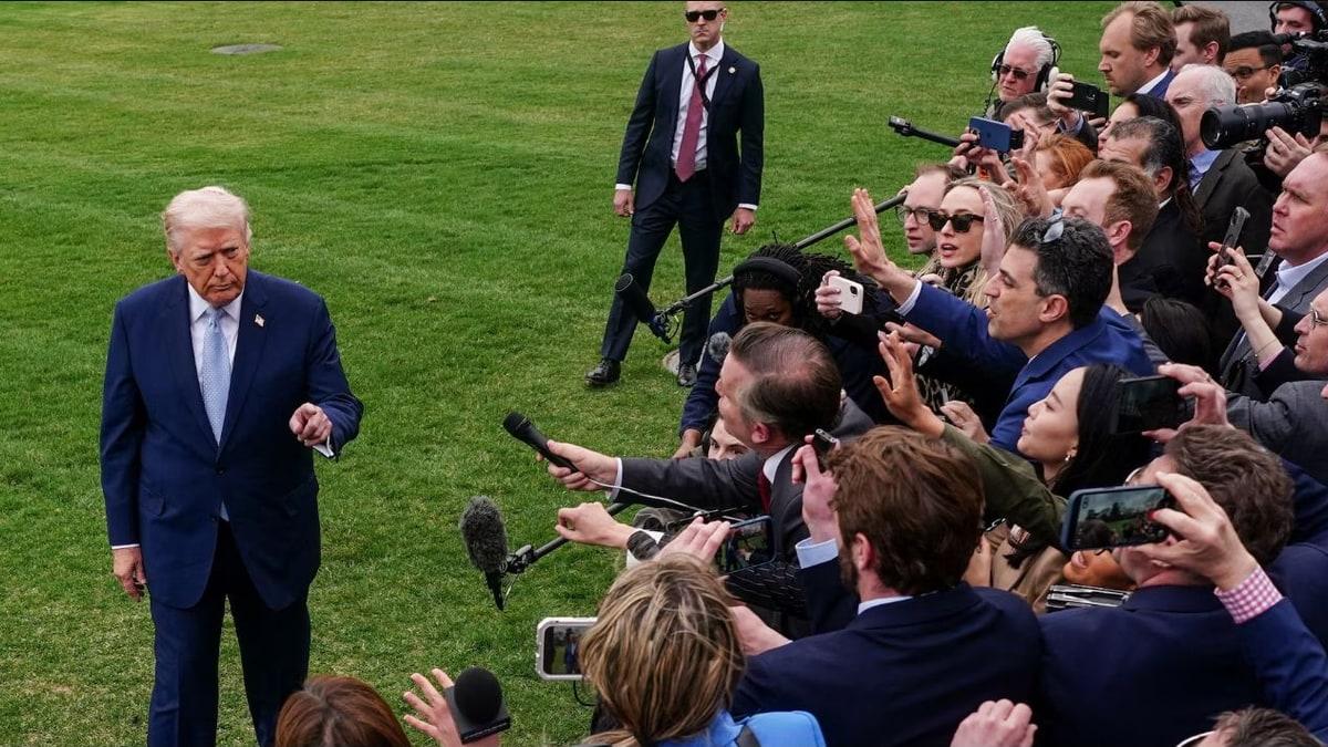 US President Donald Trump speaking to reporters outside the White House