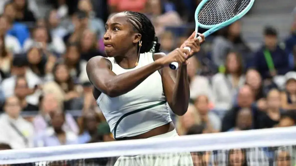 Tennis player competing under the lights at the US Open in New York