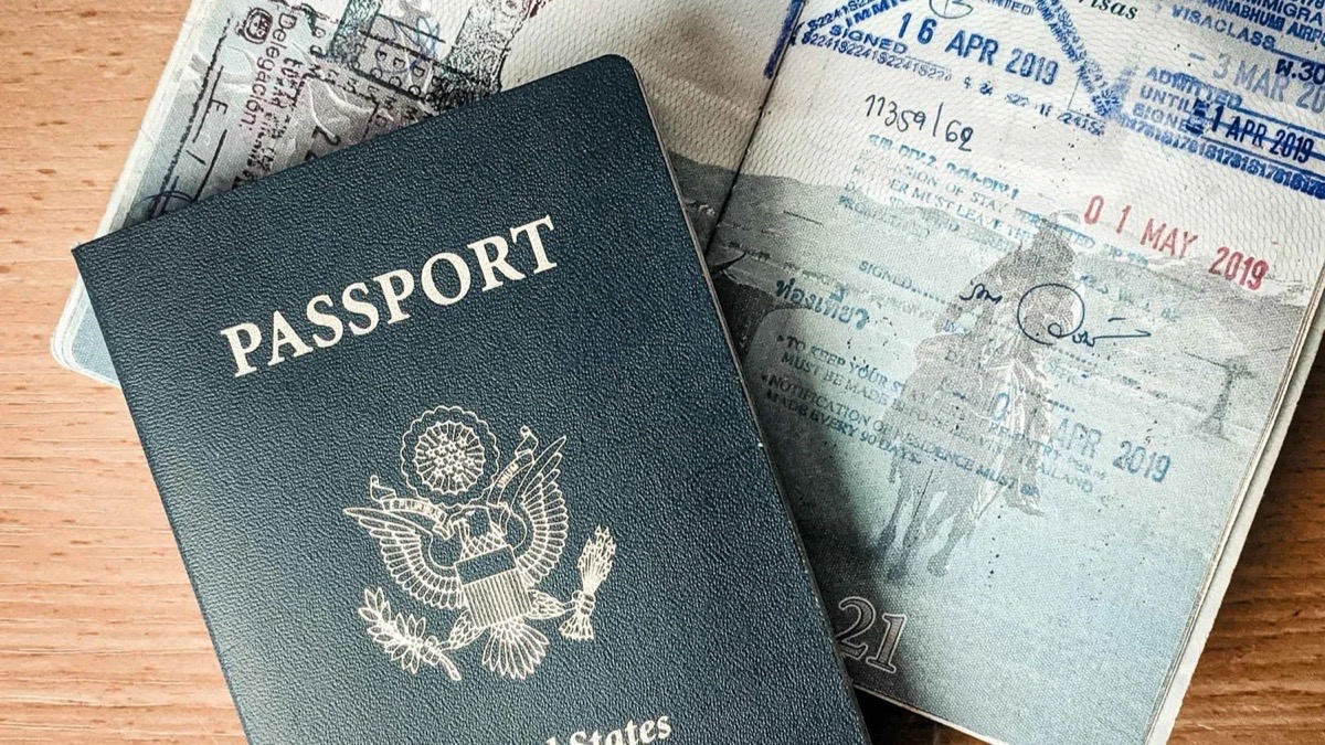 United States visa application document and passport on a desk