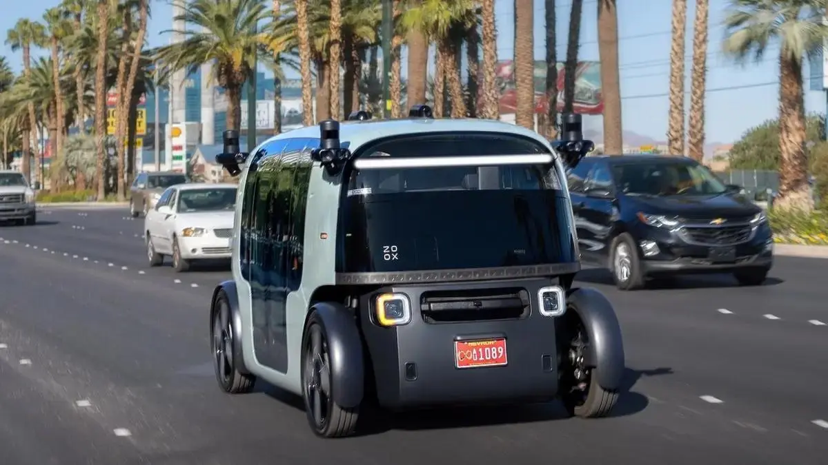 An autonomous robotaxi driving on a city street