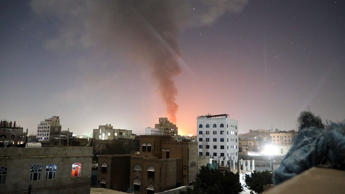 Smoke rising above Sanaa in a real file photograph from an earlier air strike on Yemen's capital